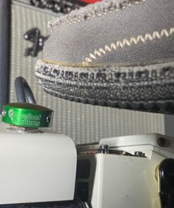 A shoe pressing a Barefoot Buttons V1 Standard Green footswitch topper installed on a guitar pedal.