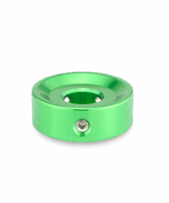 A green metal object with a hole in it.