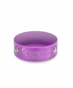 Barefoot Buttons V1 Standard Purple footswitch topper displayed on a dark background, highlighting its vibrant color and sleek design.