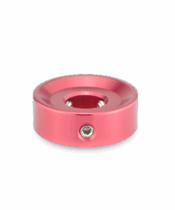 A pink metal object with a hole in it.
