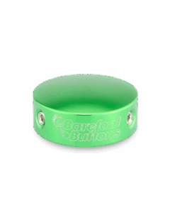 A green bracelet with the words " barefoot builders ".
