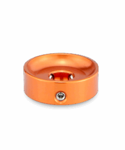 A close up of an orange object on a black background