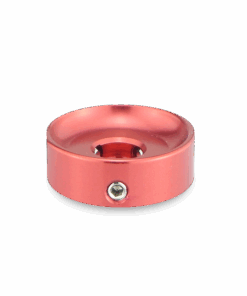 A red metal object with a hole in it.