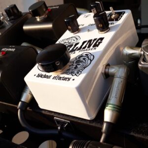 Barefoot Buttons V1 Standard Black footswitch topper installed on a Blackout Effectors guitar pedal.
