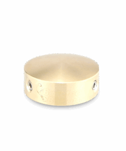 Barefoot Buttons V1 Standard Brass footswitch topper displayed on a dark background, highlighting its vibrant color and sleek design.
