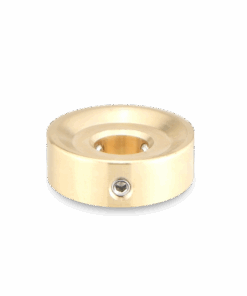 A gold colored metal object with a hole in the middle.