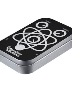 A tin of black and white items with an atom on it.