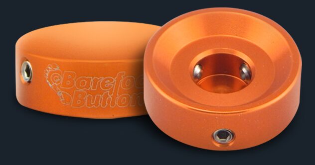 A close up of two orange buttons