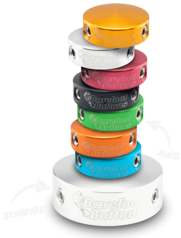 A stack of different colored bracelets with arrows pointing to the bottom.
