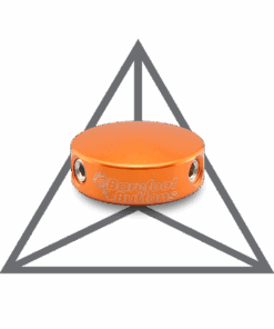 A orange drum with two metal knobs on top of it.