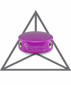 A purple object sitting in front of a triangle.