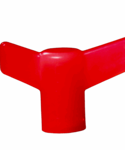 A red plastic object is sitting on the ground.