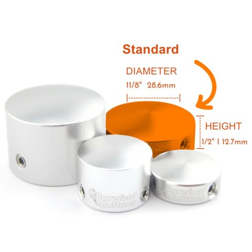 A group of four different sized metal containers.