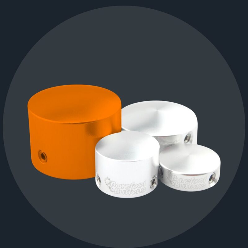 A group of three white and orange containers.