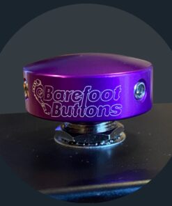 Barefoot Buttons Standard Purple installed on a guitar pedal footswitch, showing fit and profile on a standard pedal.