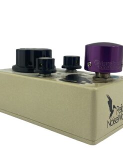 Barefoot Buttons V1 Tallboy Purple footswitch topper installed on an angled guitar effects pedal switch