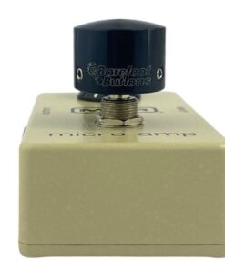 Barefoot Buttons V1 Tallboy Black footswitch topper installed on a guitar effects pedal switch, straight-on view