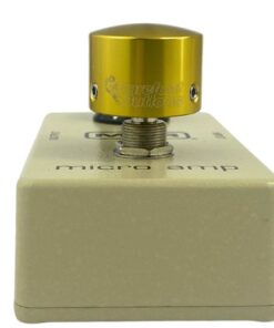 Barefoot Buttons V1 Tallboy Gold footswitch topper installed on a guitar effects pedal switch, straight-on view