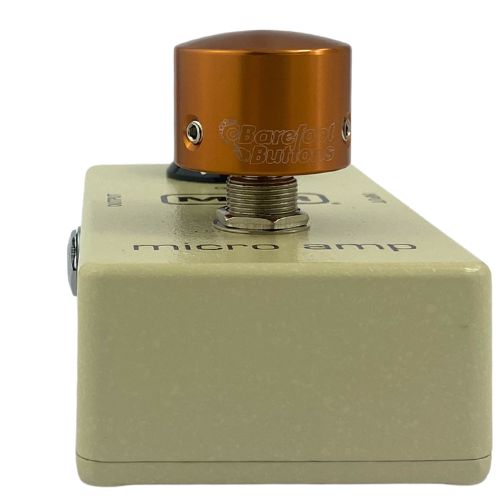 Barefoot Buttons V1 Tallboy Orange footswitch topper installed on a guitar effects pedal switch, straight-on view