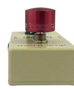 Barefoot Buttons V1 Tallboy Red footswitch topper installed on a guitar effects pedal switch, straight-on view